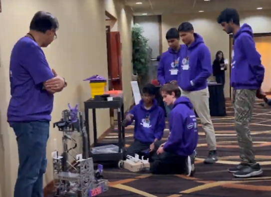 Students presenting robots at the PNSQC STEM Fair